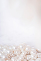 Pile of pearls on the white background