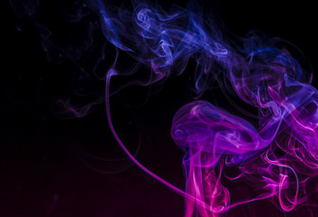 Colored smoke on black background