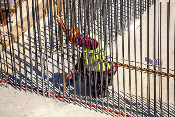 Worker measuring formwork for pouring concrete 3