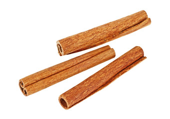 Three cinnamon sticks isolated on a white background
