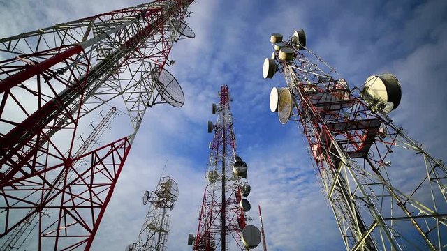 4K Timelapse of Telecommunication mast TV antennas wireless technology with blue sky