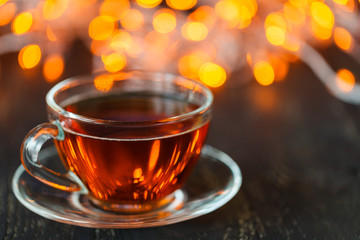 Hot tea in Christmas in a glass transparent Cup with tea