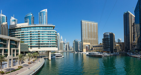 Fototapeta na wymiar Panoramic view of the canal from the bridge in the Dubai Marina area