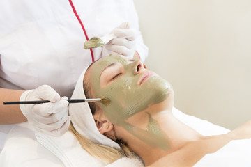 Process cosmetic mask of massage and facials in beauty salon