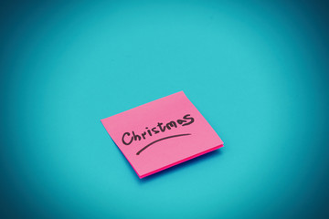 Pink sticker which inform about Christmas