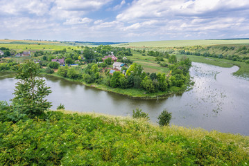Fototapeta na wymiar Aerial view of Zhvanchyk River, tributary of the Dniester from castle ruins in Zhvanets town, Ukraine