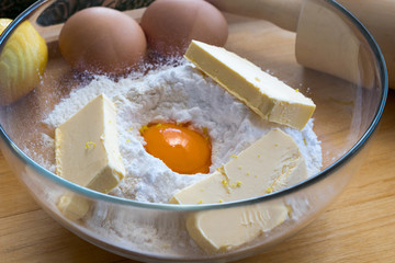 Ingredients for traditional Linzer Christmas cookies in a glass bowl