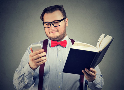 Content student with book and smartphone