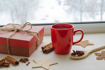 Obraz na płótnie Canvas cup of black coffee on a winter window sill