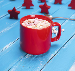 hot chocolate with marshmallow in a red ceramic mug