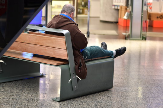 A Man is rasting on a bench in Berlin 