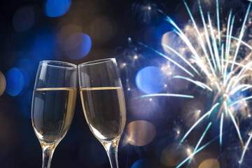 Champagne glasses on sparkling background