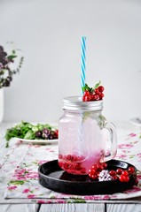 Lemonade in jars, on the kitchen table at home