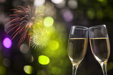 Champagne glasses on sparkling background