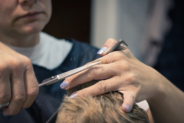 Obraz na płótnie Canvas Close up of haircut in salon.