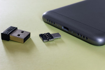  memory card with a phone adapter next to the gadget