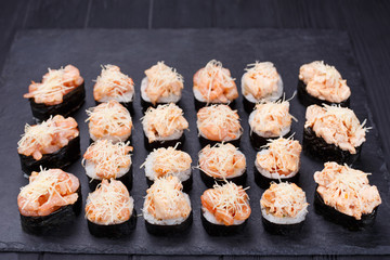 Luxury restaurant sushi menu. Sushi rolls set decorated with shrimps and parmesan cheese. Food art, Japanese meals