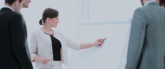 copywriter and designers to stand next to a blank poster and dis