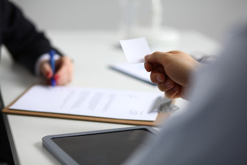 Businesswoman sitting in office, working with laptop computer