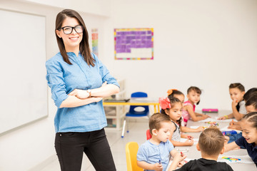 Preschool teacher with her students in a classroom