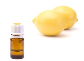 Lemon Essential Oil in a Container on a White Background