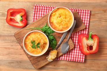 Ramekins with corn pudding on table