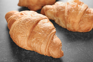 Delicious croissant on table, closeup