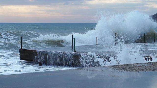 Power of sea waves. waves Crush the concrette coast