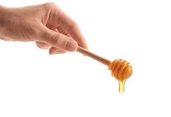 Woman holding dipper with honey, isolated on white