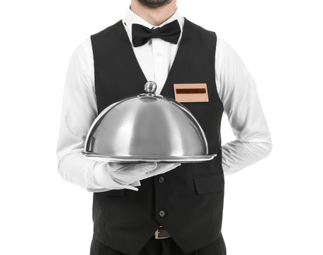 Waiter with metal tray and cloche on white background, closeup