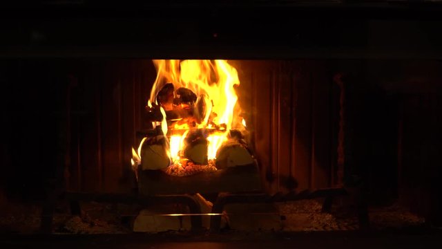 Video of a fireplace and Christmas lights