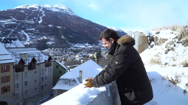 Man throws a snowballs