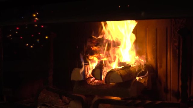 Video of a fireplace and Christmas lights