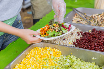 making salad with vegetable and grain nut for healthy food