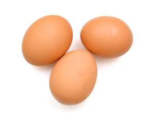 Fototapeta na wymiar Brown egg on white background