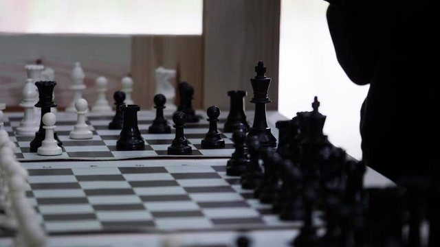 Beautiful shot of chessboard and chess pieces in slow motion. Rack focus.