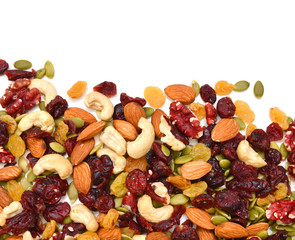 Mix nuts, dry fruits and grapes on a white background