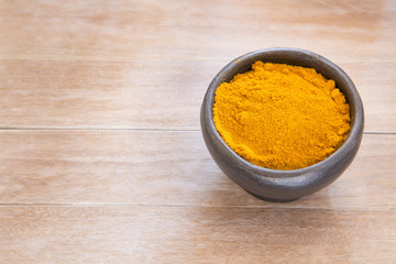 Turmeric powder in the bowl - Curcuma longa