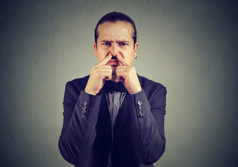 Man suffering from bad smell