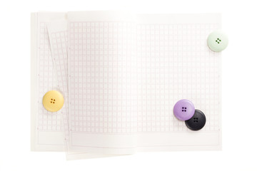 note spread with button isolated on the white background.