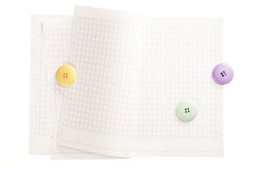 note spread with button isolated on the white background.