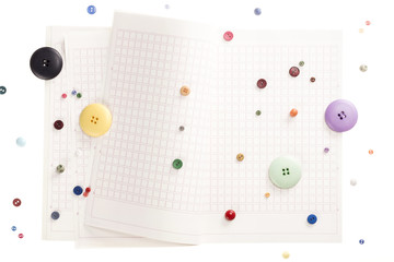 note spread with button isolated on the white background.