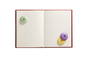 empty(blank) book spread with colorful button isolated on the white background.