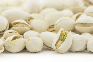 roasted pistachios nuts on white background