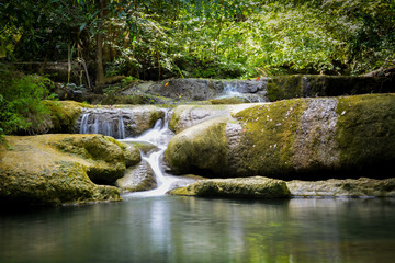 Waterfall hidden in the tropical jungle (erawan waterfall) in kanchanaburi province asia southeast asia Thailand © krung99