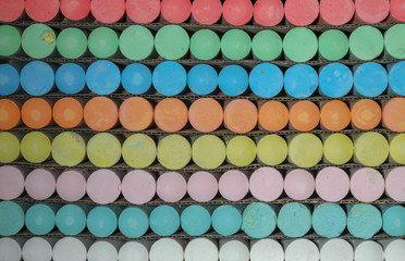 Large pieces of multi colored chalk in artistic patterns