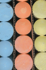 Large pieces of multi colored chalk in artistic patterns