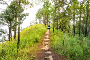 marathon runner running at asian angel statue,asia trail run concept