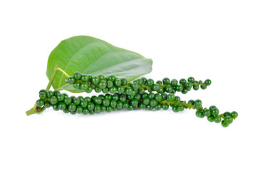 green peppercorns with stem and leaf on white background