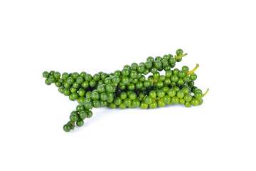 pile of green peppercorns on white background